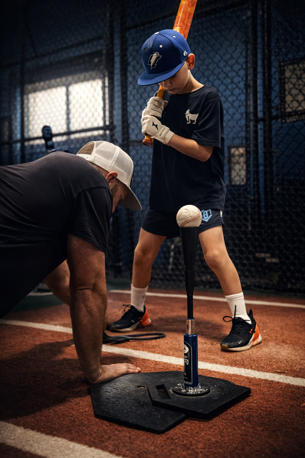Coach Steve showing a hitter proper feet alignment and distance from the plate